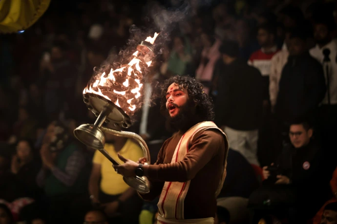 A man performs a fire ritual.